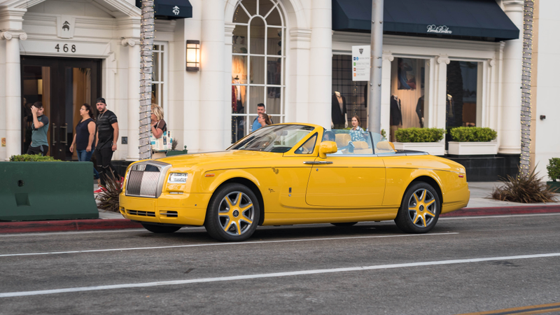 The famous yellow Rolls Royce that can be found outside the House of Bijan
